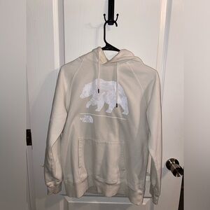 The North Face cream women's pull over hoodie